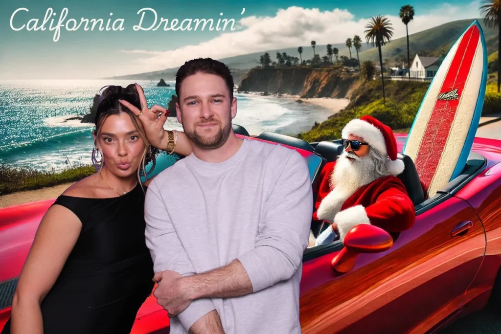 Couple posing in a green screen photo booth with a fun 'California Dreamin’' backdrop featuring Santa Claus driving a red convertible with a surfboard along a scenic coastal highway
