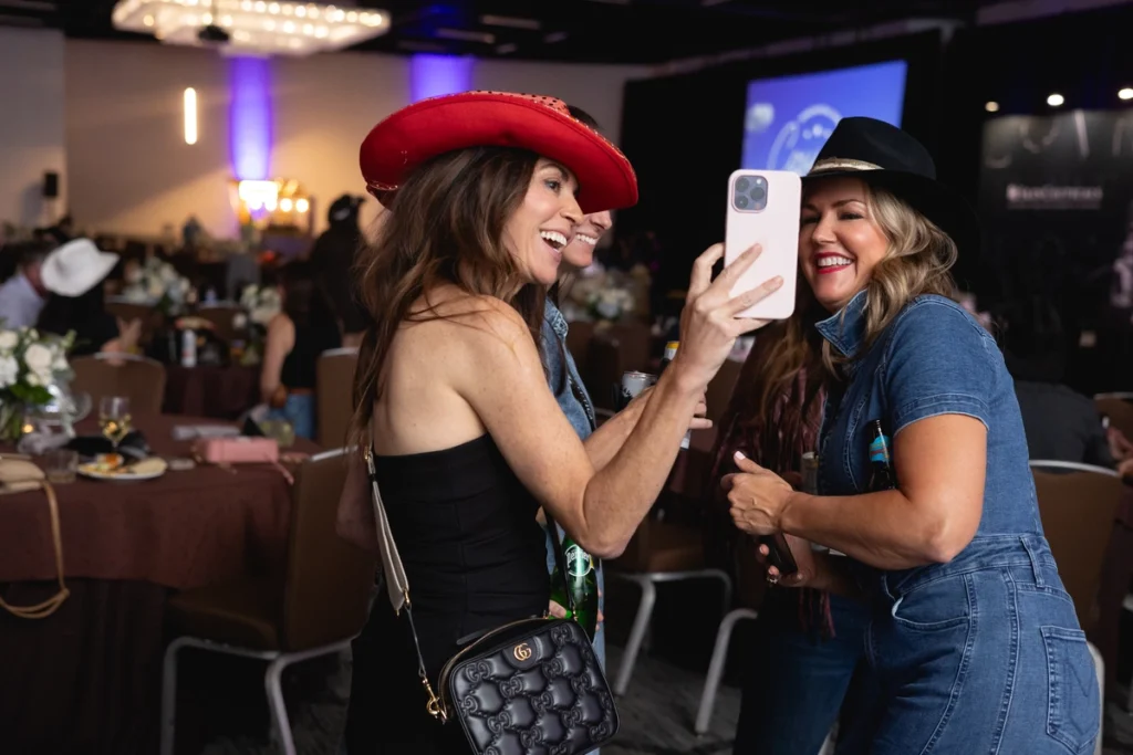 Two woman taking a selfie at Skinceutical Event covered by GC Event Studio.