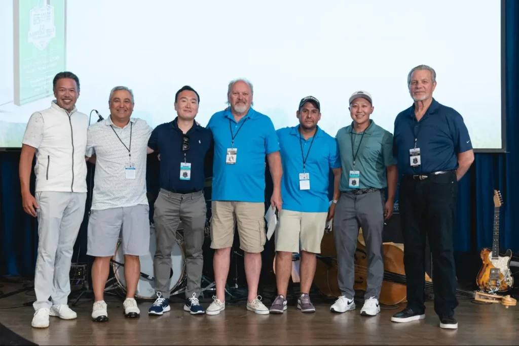 Group of colleagues posing together during a corporate team-building event.