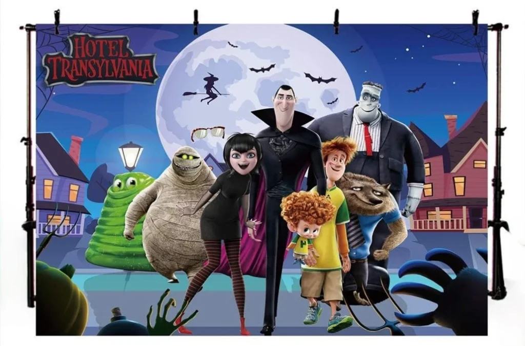 Haunted hotel Transylvania-themed fall festival photo booth backdrop with spooky decorations.