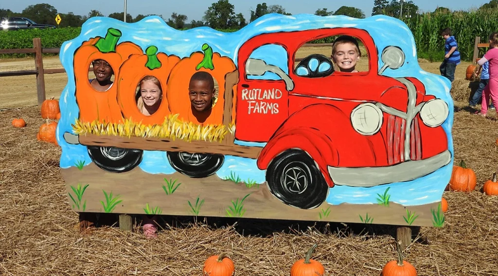 Pumpkin Joyride themed cutout both backdrop with face holes