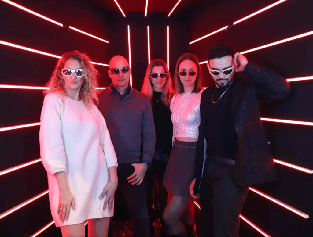 Team building activity with a stylish neon-lit photo booth.