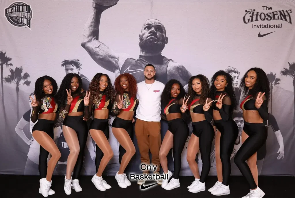 Basketball-themed photo activation with dance team and Nike branding at 'The Chosen Invitational' event with Basketball Hall of Fame backdrop