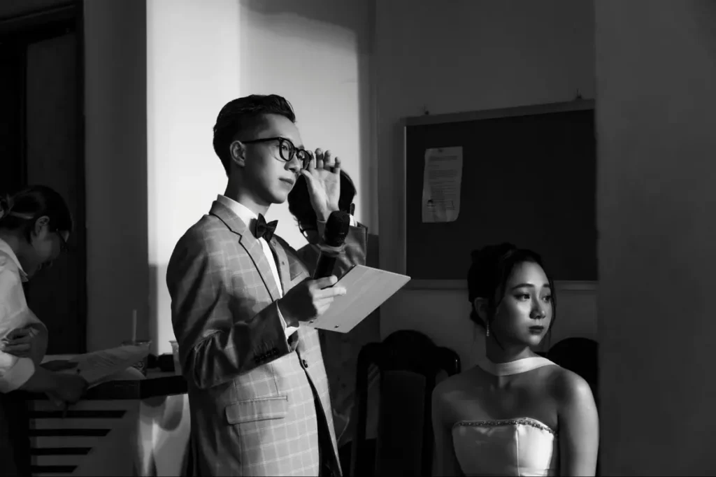 Wedding event coordinators reviewing notes and preparations in black and white