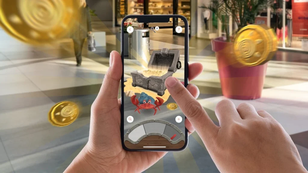Augmented reality treasure hunt game on smartphone showing virtual treasure chest and coins, modern interactive event activity