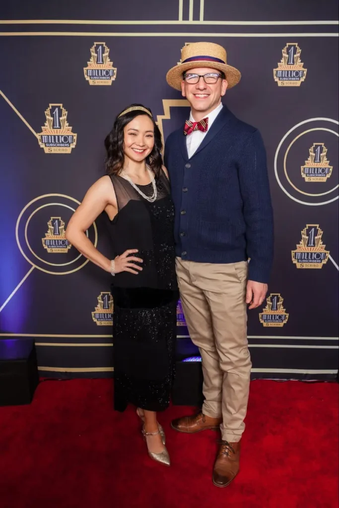 Elegantly dressed attendees at milestone celebration event with vintage-inspired 1920s fashion theme