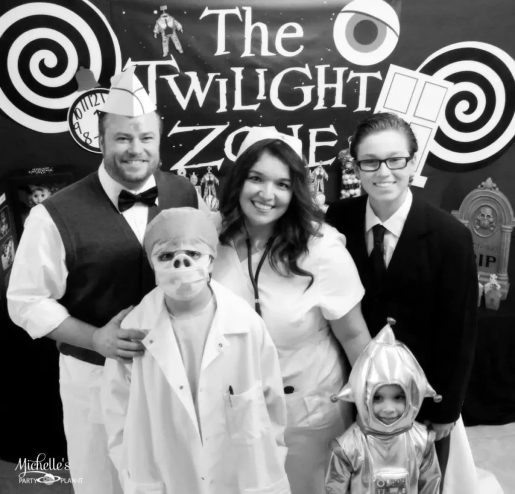 Group in Twilight Zone themed costumes including medical staff and astronaut - TV show themed Halloween party