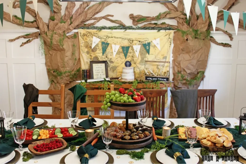 Themed dinner party with fantasy-inspired decor featuring Middle Earth map backdrop and forest elements - Literary event celebration