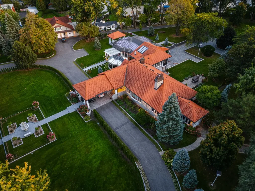 Aerial view of a luxury property and landscaped grounds, ideal for real estate and brand marketing