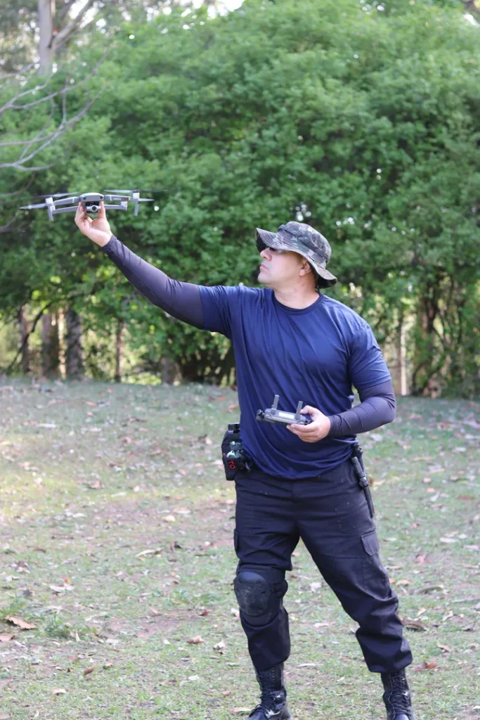 Licensed commercial drone pilot preparing for an aerial photography mission with FAA-compliant equipment for retail and event coverage